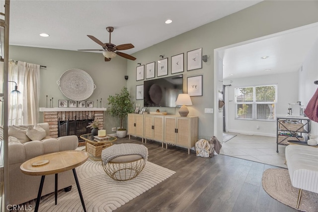 27702 Quincy St, Castaic, CA 91384 - living area featuring a ceiling fan, a fireplace, wood finished floors, recessed lighting, and baseboards