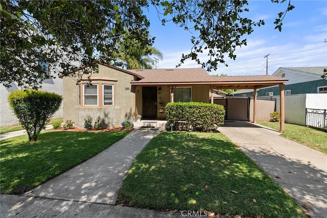 1876 Oregon Ave, Long Beach, CA 90806 - bungalow-style house with stucco siding, a carport, and driveway