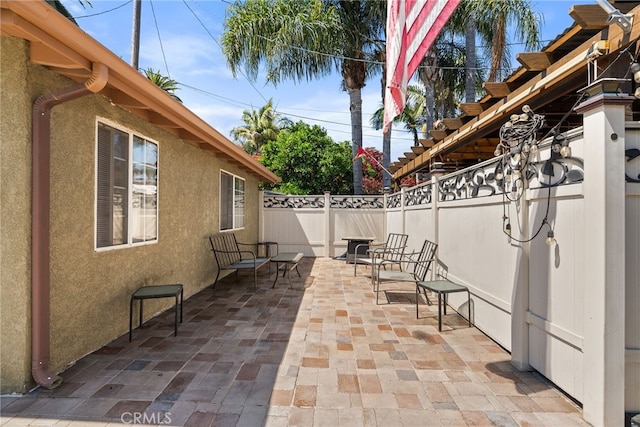 1876 Oregon Ave, Long Beach, CA 90806 - fenced backyard featuring a patio
