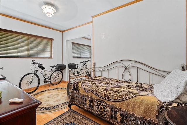 1876 Oregon Ave, Long Beach, CA 90806 - bedroom featuring wood finished floors, crown molding, and a closet