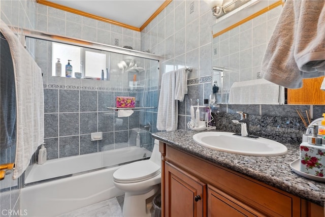 1876 Oregon Ave, Long Beach, CA 90806 - bathroom with vanity, ornamental molding, bath / shower combo with glass door, toilet, and decorative backsplash