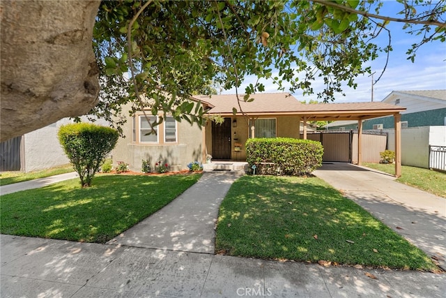 1876 Oregon Ave, Long Beach, CA 90806 - view of front of home featuring driveway, an attached carport, and stucco siding