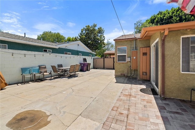 1876 Oregon Ave, Long Beach, CA 90806 - fenced backyard with a patio and outdoor dining area