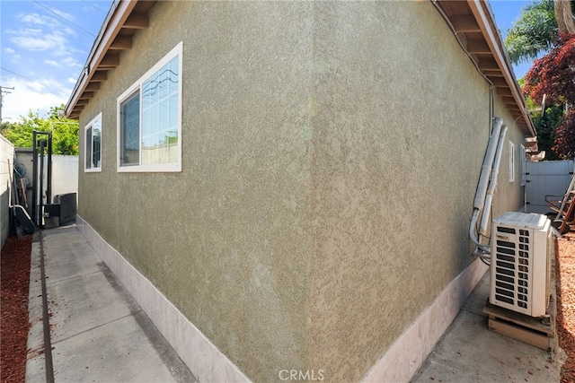 1876 Oregon Ave, Long Beach, CA 90806 - view of side of property featuring stucco siding and ac unit