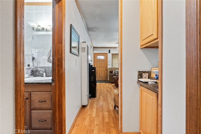 1876 Oregon Ave, Long Beach, CA 90806 - hallway with a sink and light wood finished floors