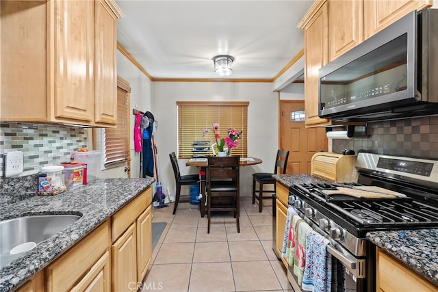 1876 Oregon Ave, Long Beach, CA 90806 - kitchen featuring appliances with stainless steel finishes, light brown cabinetry, tasteful backsplash, and ornamental molding