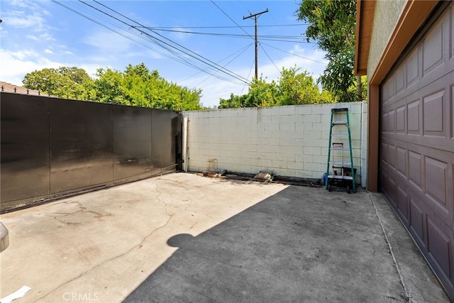 1876 Oregon Ave, Long Beach, CA 90806 - view of patio / terrace with a garage
