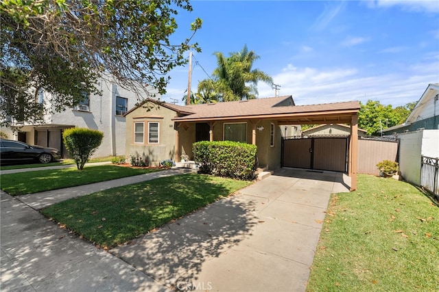 1876 Oregon Ave, Long Beach, CA 90806 - view of front of home featuring a gate, concrete driveway, stucco siding, and a carport