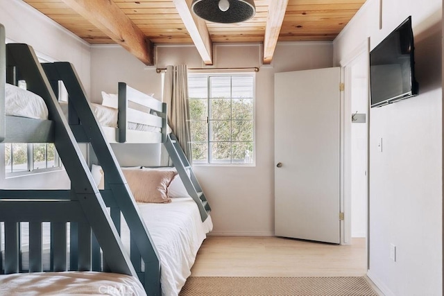 960 Butte Ave, Big Bear City, CA 92314 - bedroom featuring wood ceiling with exposed beams, multiple windows, wood finished floors, and baseboards