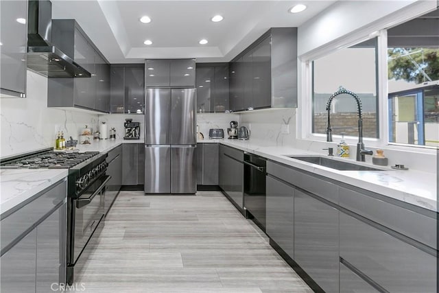 10670 Deering Ave, Chatsworth, CA 91311 - kitchen featuring gray cabinetry, black appliances, wall chimney exhaust hood, a sink, and modern cabinets