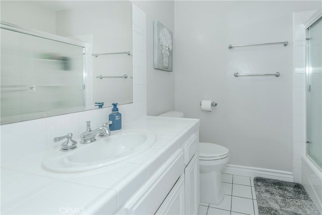 10670 Deering Ave, Chatsworth, CA 91311 - bathroom featuring toilet, vanity, tile patterned floors, and enclosed tub / shower combo