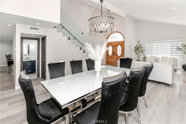 10670 Deering Ave, Chatsworth, CA 91311 - dining space featuring stairs, a chandelier, light wood finished floors, recessed lighting, and healthy amount of natural light