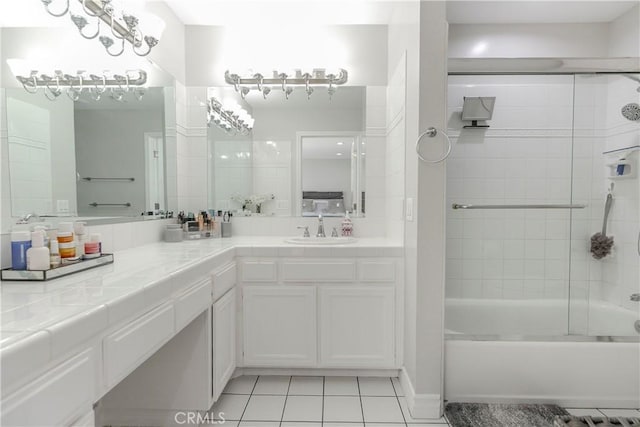 10670 Deering Ave, Chatsworth, CA 91311 - full bathroom featuring tile patterned flooring, vanity, and shower / bath combination with glass door