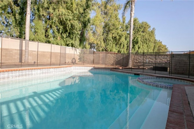 10670 Deering Ave, Chatsworth, CA 91311 - view of swimming pool with a fenced backyard and a pool with connected hot tub