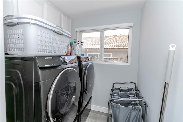 10670 Deering Ave, Chatsworth, CA 91311 - laundry area with washing machine and dryer, baseboards, and light wood-style floors