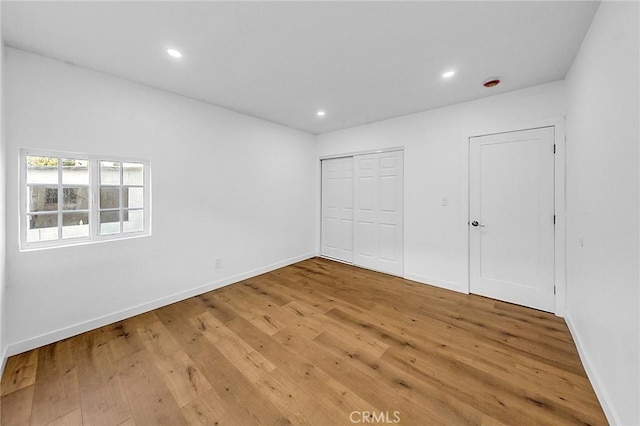 401 W Poplar St, Compton, CA 90220 - unfurnished bedroom featuring light wood-style floors and recessed lighting