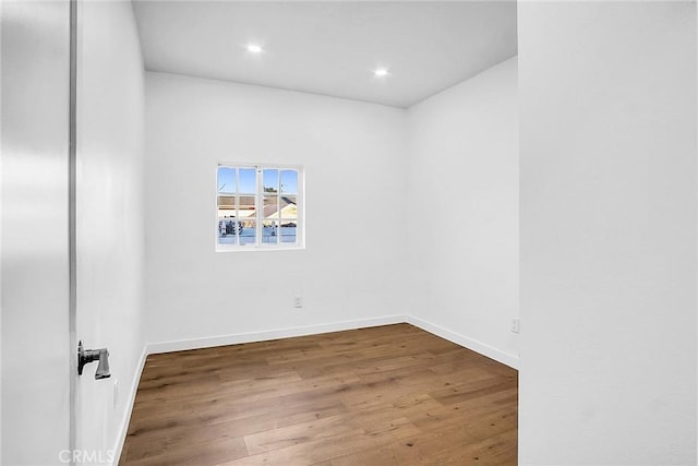 401 W Poplar St, Compton, CA 90220 - spare room featuring wood finished floors, recessed lighting, and baseboards