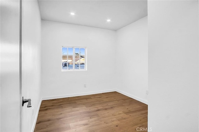 401 W Poplar St, Compton, CA 90220 - empty room with wood finished floors and recessed lighting