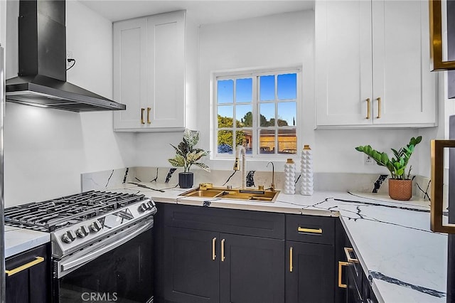 401 W Poplar St, Compton, CA 90220 - kitchen featuring range hood, stainless steel gas range, white cabinets, and a sink