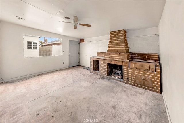 401 W Poplar St, Compton, CA 90220 - unfurnished living room featuring ceiling fan, concrete floors, and a brick fireplace
