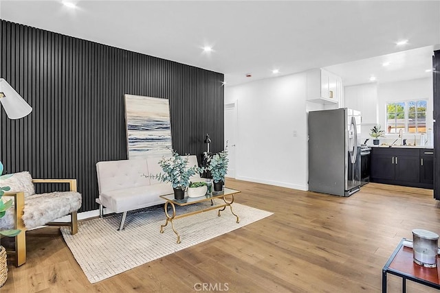 401 W Poplar St, Compton, CA 90220 - living area featuring light wood-type flooring, recessed lighting, and baseboards