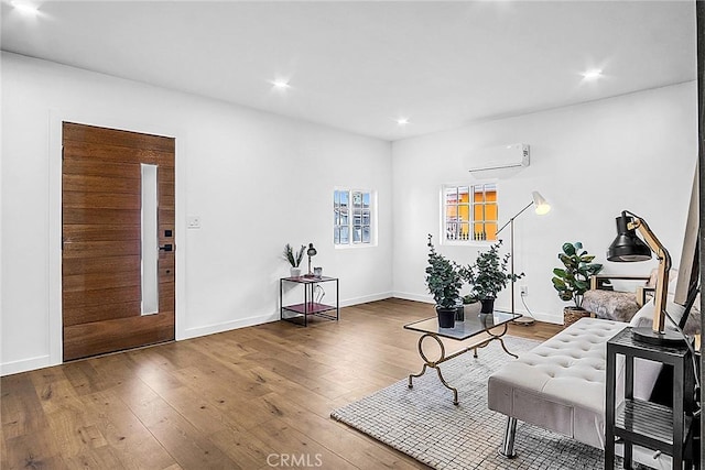 401 W Poplar St, Compton, CA 90220 - living area featuring a wall mounted AC, hardwood / wood-style flooring, and recessed lighting