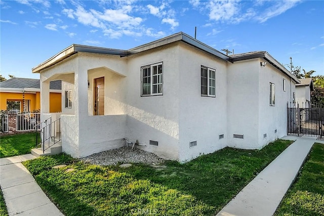 401 W Poplar St, Compton, CA 90220 - view of side of home with crawl space and stucco siding