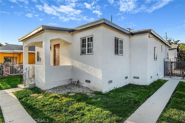 401 W Poplar St, Compton, CA 90220 - view of side of home featuring crawl space and stucco siding