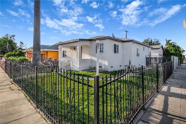 401 W Poplar St, Compton, CA 90220 - view of front of house with stucco siding and crawl space
