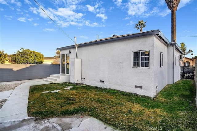 401 W Poplar St, Compton, CA 90220 - rear view of property with crawl space, stucco siding, and entry steps