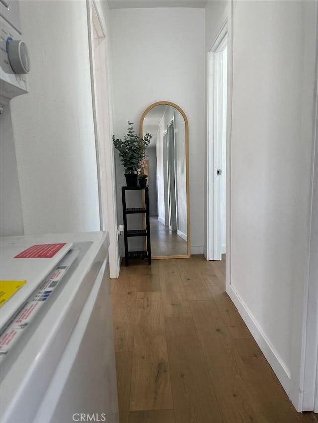 401 W Poplar St, Compton, CA 90220 - hall with light wood finished floors and arched walkways