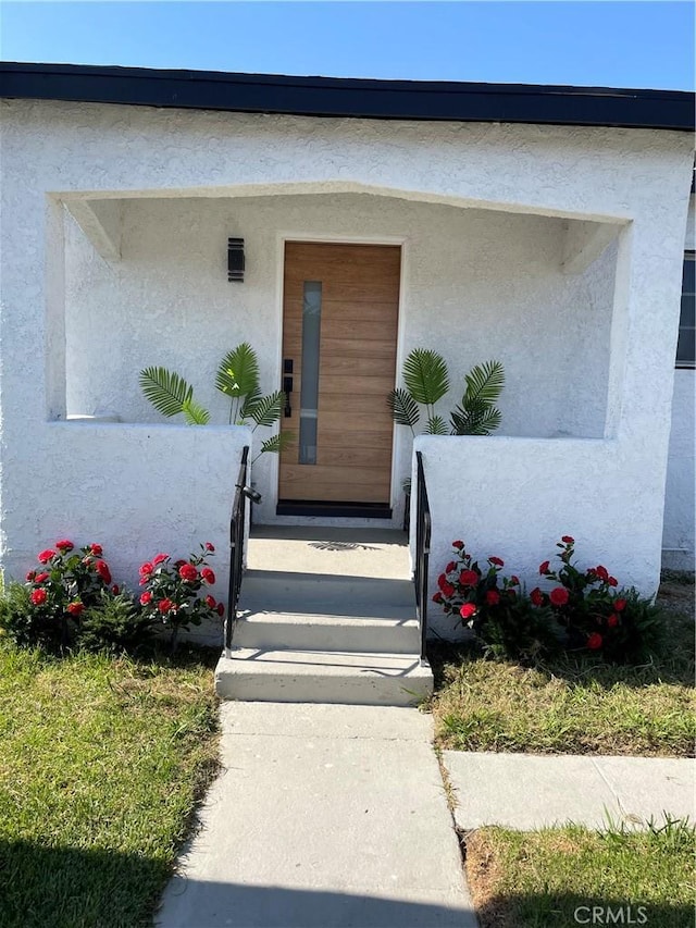 401 W Poplar St, Compton, CA 90220 - doorway to property featuring stucco siding