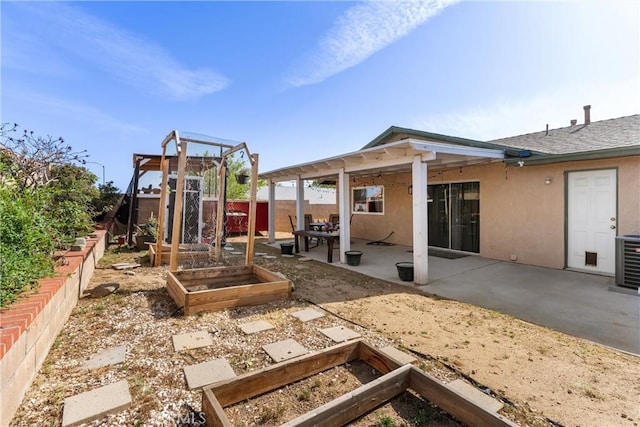42045 Thornbush Ave, Lancaster, CA 93536 - fenced backyard with a vegetable garden and a patio