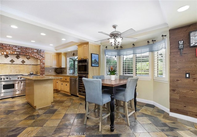 24002 Cormorant Ln, Laguna Niguel, CA 92677 - dining area with crown molding, baseboards, dark stone finish flooring, a ceiling fan, and recessed lighting