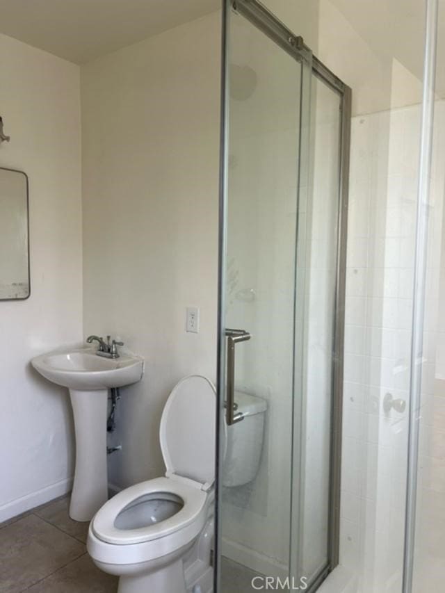 12760 Judd St, Pacoima, CA 91331 - bathroom with a shower stall, toilet, and baseboards