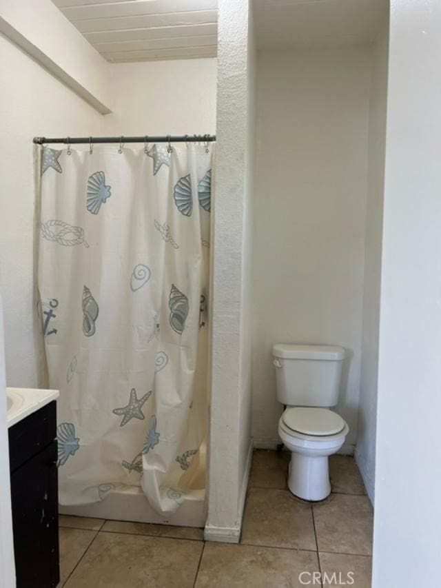 12760 Judd St, Pacoima, CA 91331 - full bath with toilet, tile patterned floors, vanity, and shower / bathtub combination with curtain