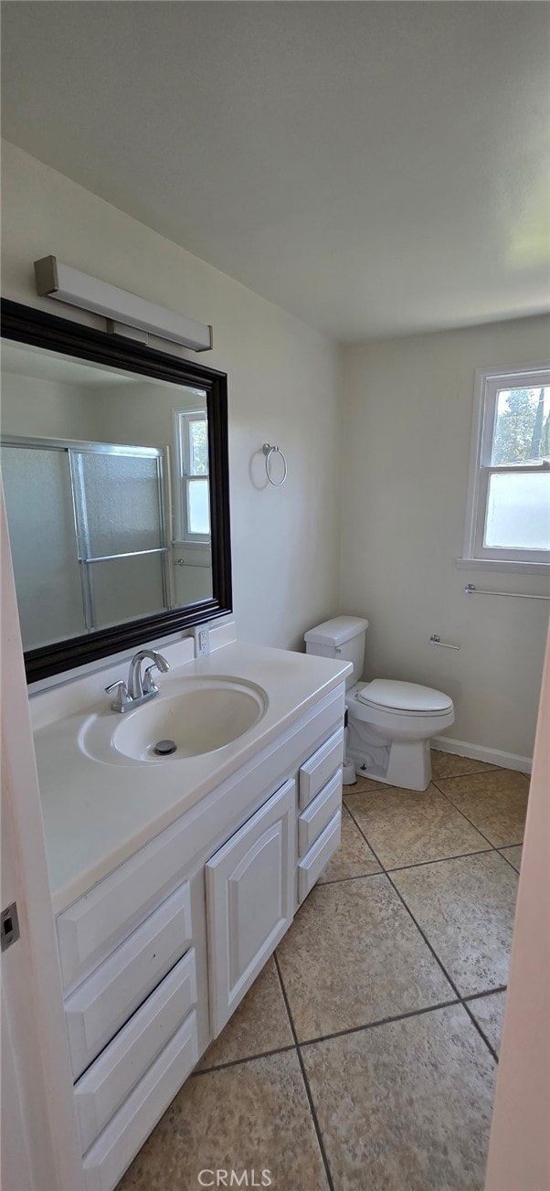 16718 Gledhill St, Northridge, CA 91343 - full bathroom with tile patterned flooring, toilet, vanity, and a shower