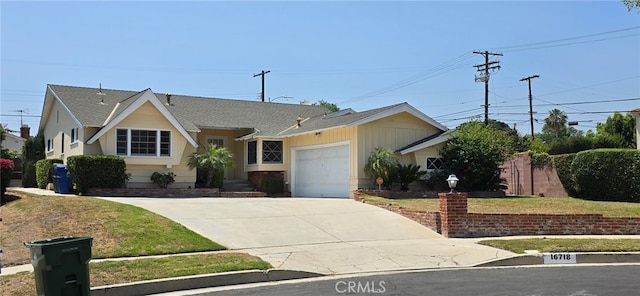 16718 Gledhill St, Northridge, CA 91343 - ranch-style home featuring concrete driveway, a garage, a shingled roof, and a front lawn