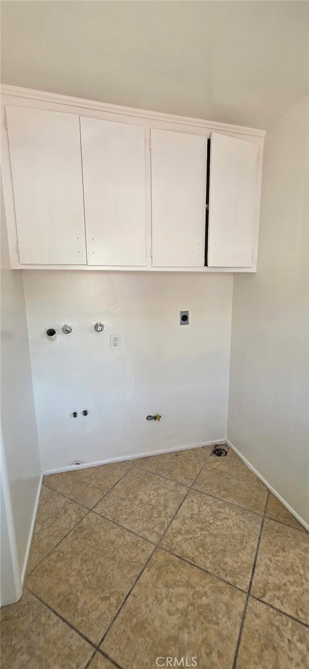16718 Gledhill St, Northridge, CA 91343 - laundry room with baseboards, hookup for an electric dryer, cabinet space, and tile patterned floors