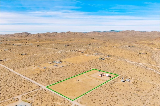 55850 Shannon Rd, Landers, CA 92285 - view of rural area featuring a desert landscape, a mountain backdrop, and property boundaries highlighted