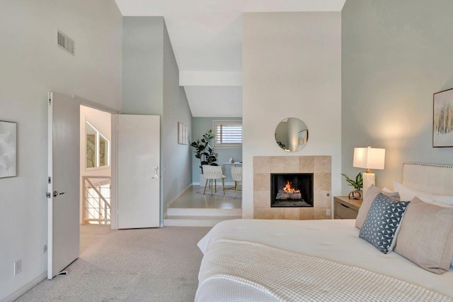 55 Jasmine Creek Dr, Corona Del Mar, CA 92625 - bedroom featuring carpet, a tiled fireplace, and high vaulted ceiling