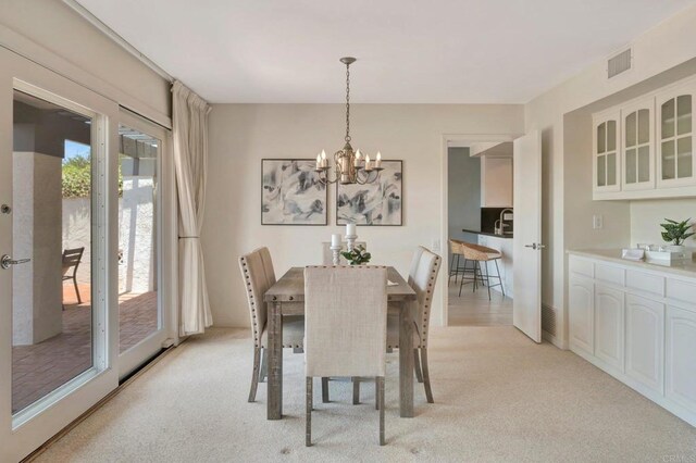 55 Jasmine Creek Dr, Corona Del Mar, CA 92625 - dining area featuring light carpet and a chandelier