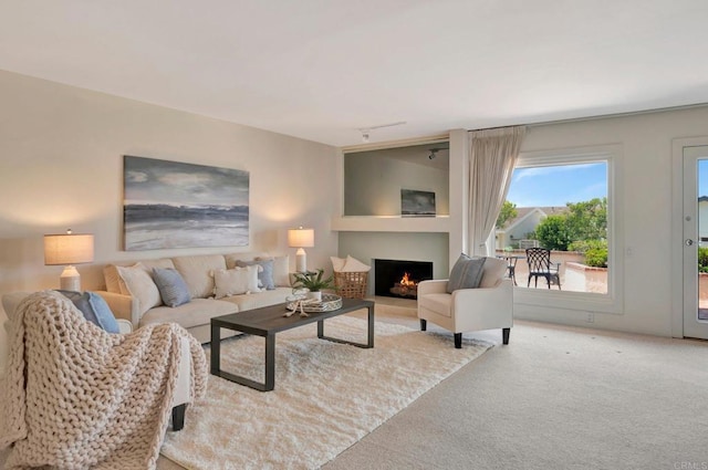 55 Jasmine Creek Dr, Corona Del Mar, CA 92625 - living area with carpet, a lit fireplace, and rail lighting