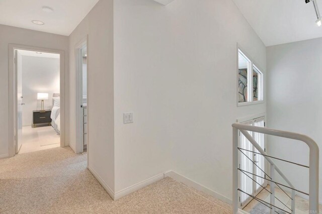 55 Jasmine Creek Dr, Corona Del Mar, CA 92625 - corridor with an upstairs landing and light carpet