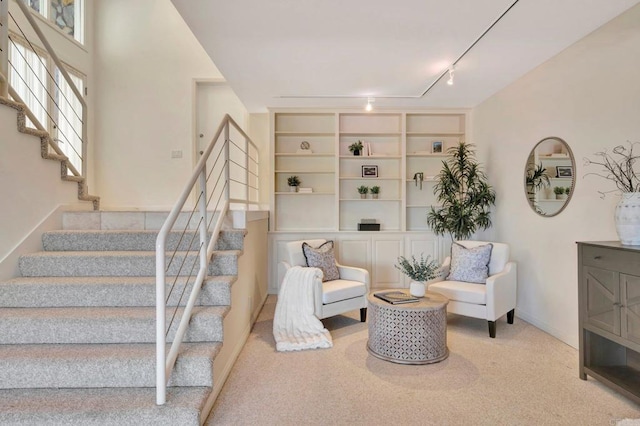 55 Jasmine Creek Dr, Corona Del Mar, CA 92625 - living area featuring stairway, rail lighting, and carpet