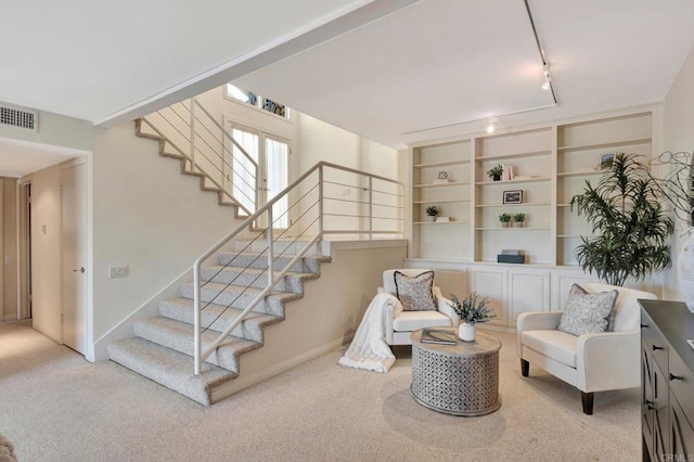 55 Jasmine Creek Dr, Corona Del Mar, CA 92625 - sitting room with stairway, carpet flooring, and track lighting