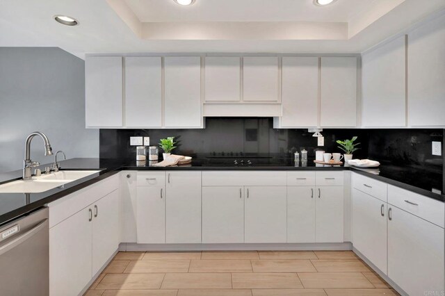 55 Jasmine Creek Dr, Corona Del Mar, CA 92625 - kitchen featuring stainless steel dishwasher, a raised ceiling, black electric cooktop, recessed lighting, and white cabinetry
