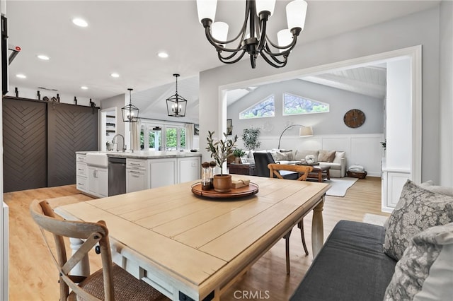 3061 Ruth Elaine, Los Alamitos, CA 90720 - dining space featuring a chandelier, light wood finished floors, lofted ceiling, wainscoting, and recessed lighting