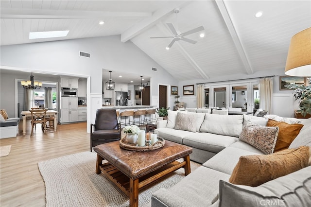 3061 Ruth Elaine, Los Alamitos, CA 90720 - living room featuring high vaulted ceiling, light wood-style flooring, a chandelier, beamed ceiling, and a skylight