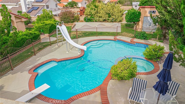 5340 Gardendale Ln, Palmdale, CA 93551 - view of swimming pool featuring a water slide, a diving board, a patio, a pool with connected hot tub, and a residential view
